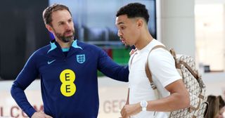 Gareth Southgate, Manager of England, greets Trent Alexander-Arnold of England as he arrives at St George's Park on October 09, 2023 in Burton upon Trent, England. 