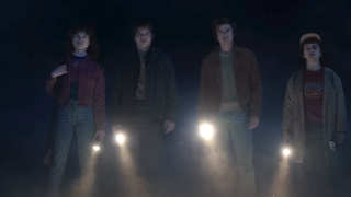 Nancy, Jonathan, Steve and Dustin holding flashlights in stranger things season 5 trailer