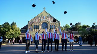 Stanford graduated students get photos taken after graduation ceremony at Stanford University in Stanford, California, United States on June 12, 2024.