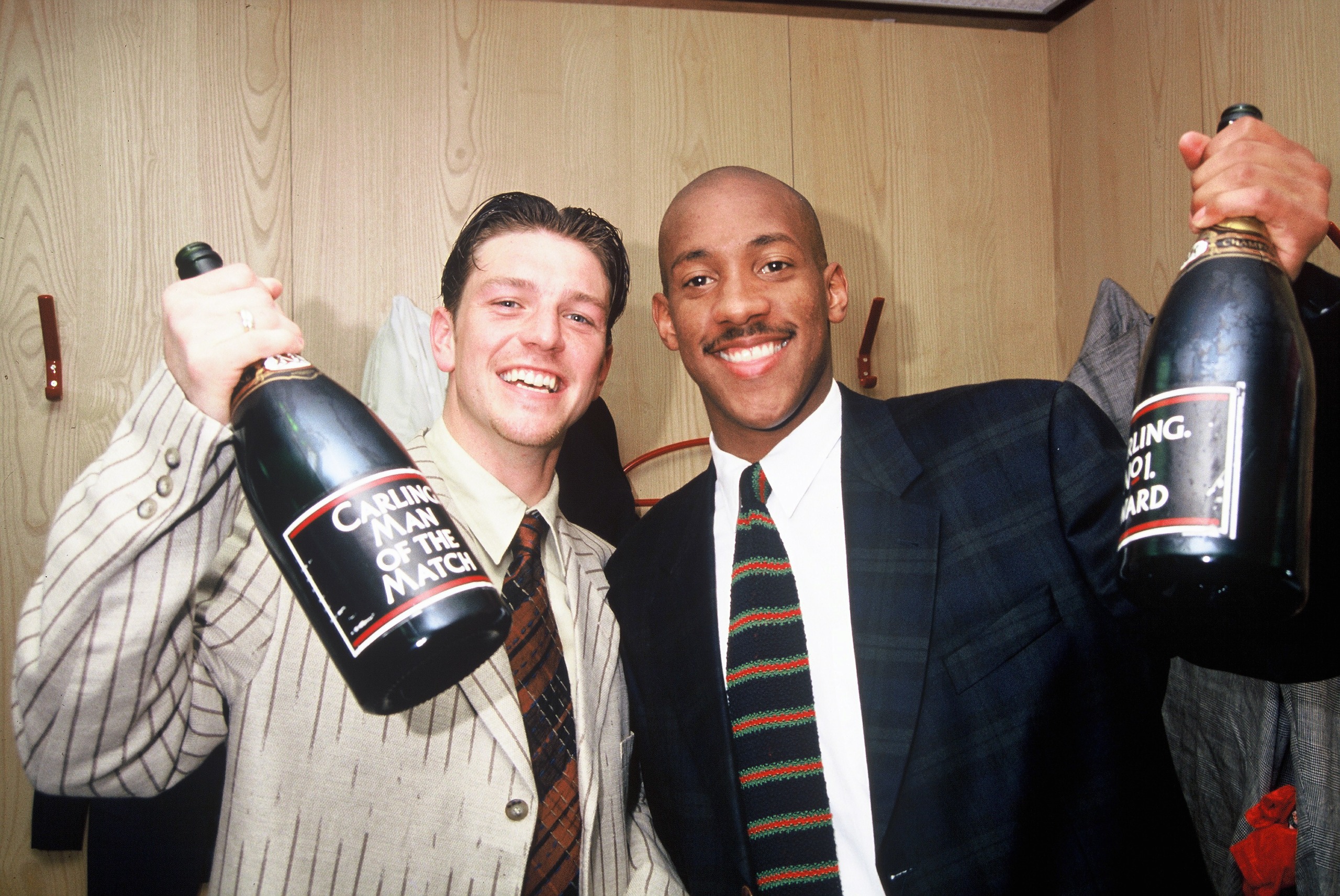 Dion Dublin (R) celebrates winning the Premier League title with Manchester United in 1994