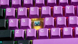 A black and purple Epomaker EK68 wireless mechanical keyboard