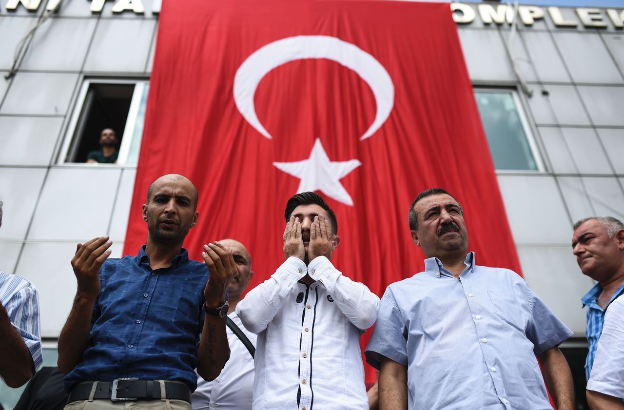 People mourn for victims of the Istanbul airport attack.