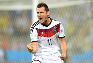 Miroslav Klose celebrates after scoring for Germany against Ghana at the 2014 World Cup.