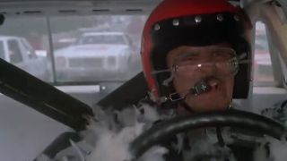 Burt Reynolds racing in a stock car in Stroker Ace