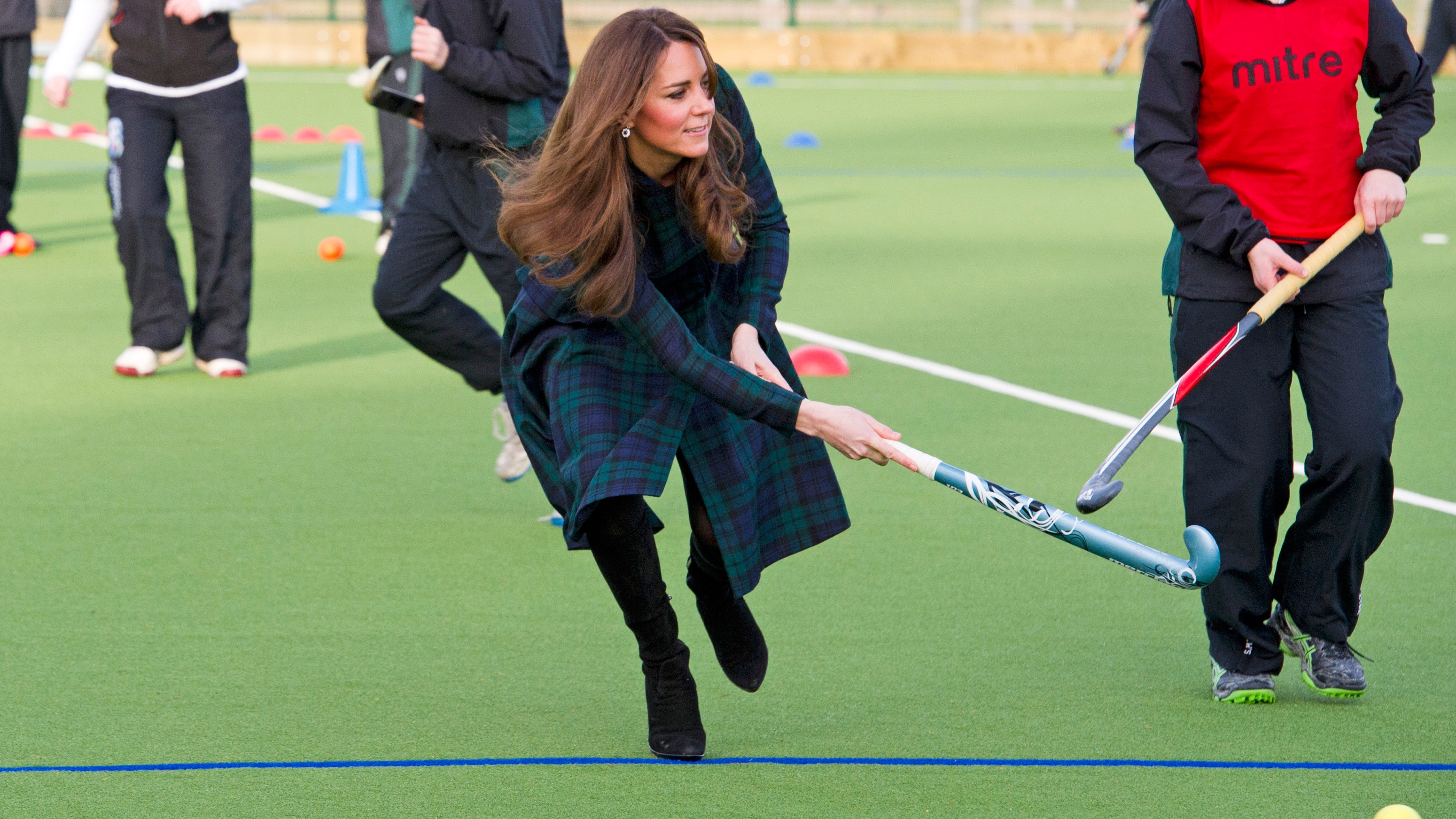 Kate Middleton takes part in a game of hockey at St Andrew&#039;s School on November 30, 2012
