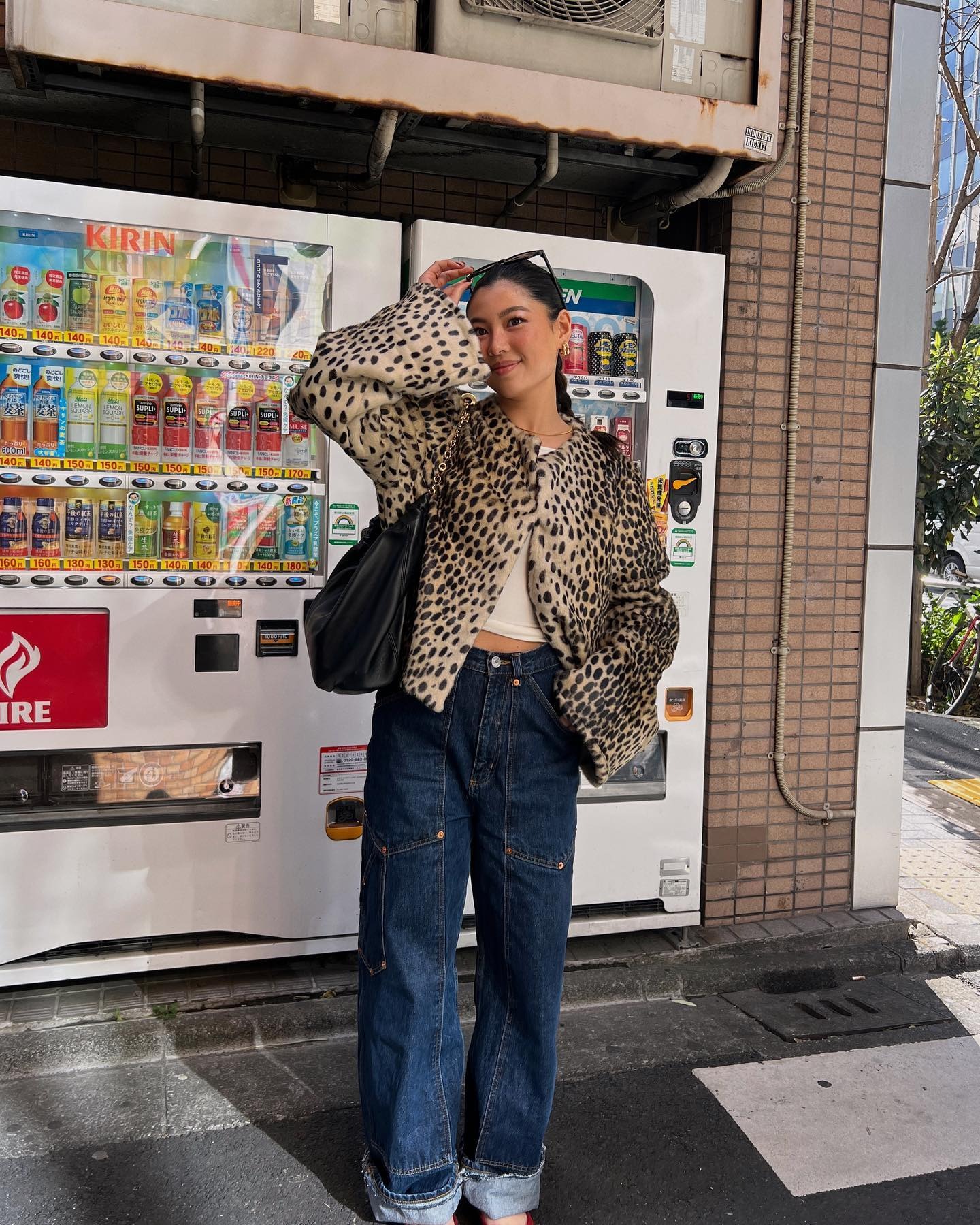 Fashion person Michelle Ngatimin wears the cropped leapord print coat trend.