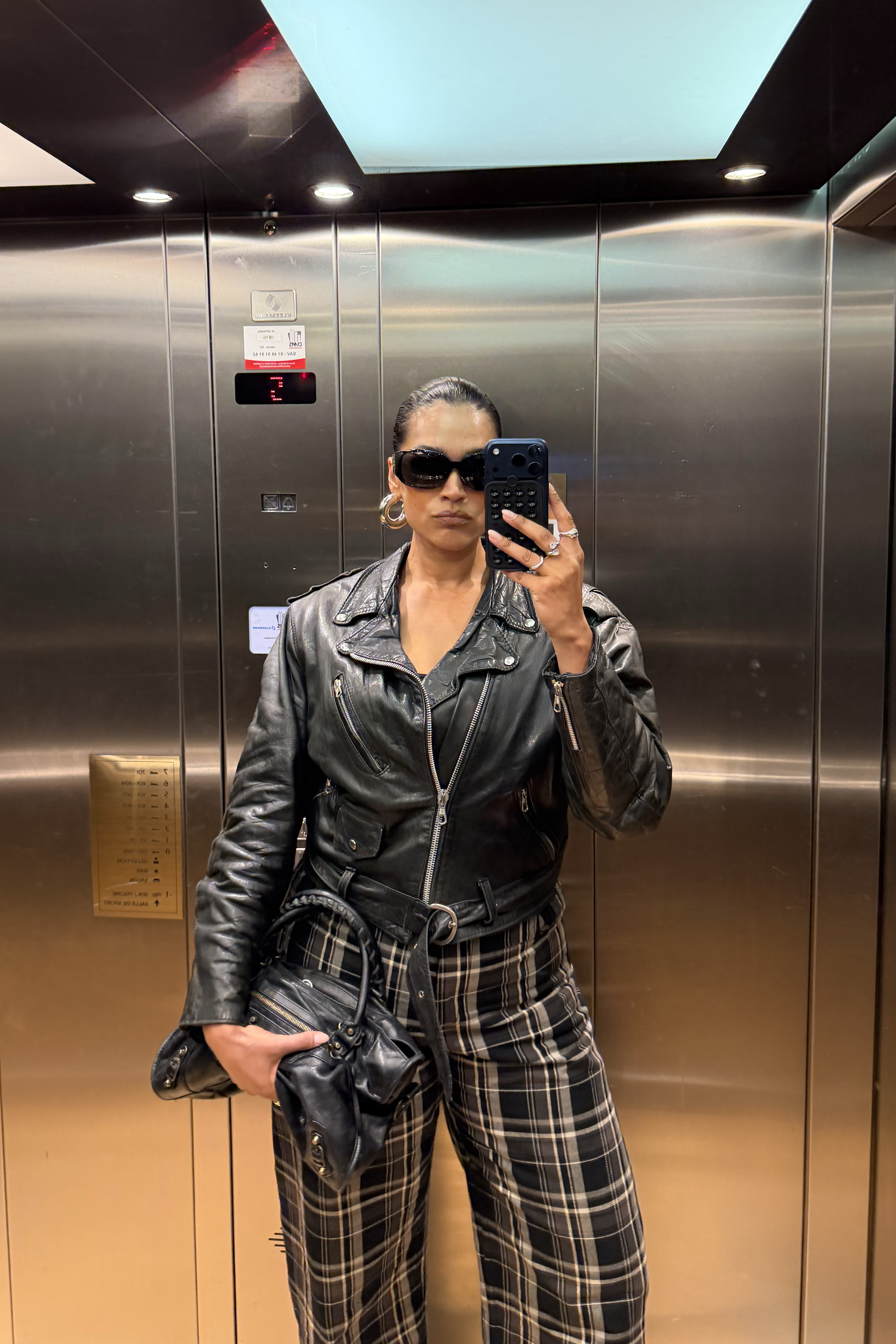 Jennifer Atilemile wearing a leather jacket.