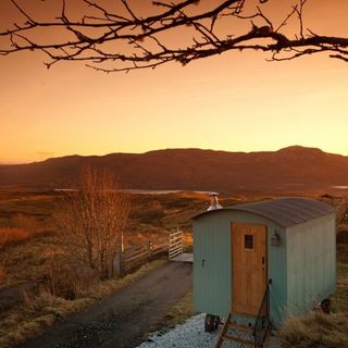 hut with road and sunset view