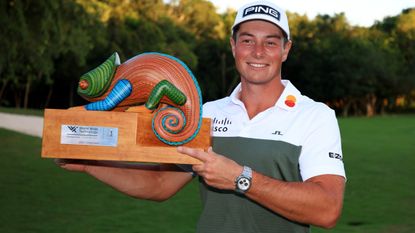 Viktor Hovland with the trophy after winning the 2021 World Wide Technology Championship