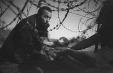 Warren Richardson - Hope for New Life, showing refugees at the Hungarian border