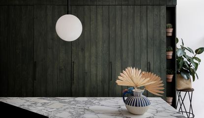 An angular marble topped kitchen island