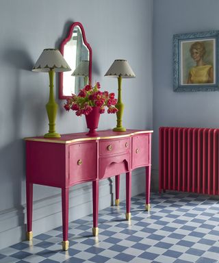 Magenta hallway mirror idea with coordinating dresser drawer and radiator