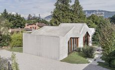 Situated in a town on the outskirts of Geneva within an elongated hillside plot