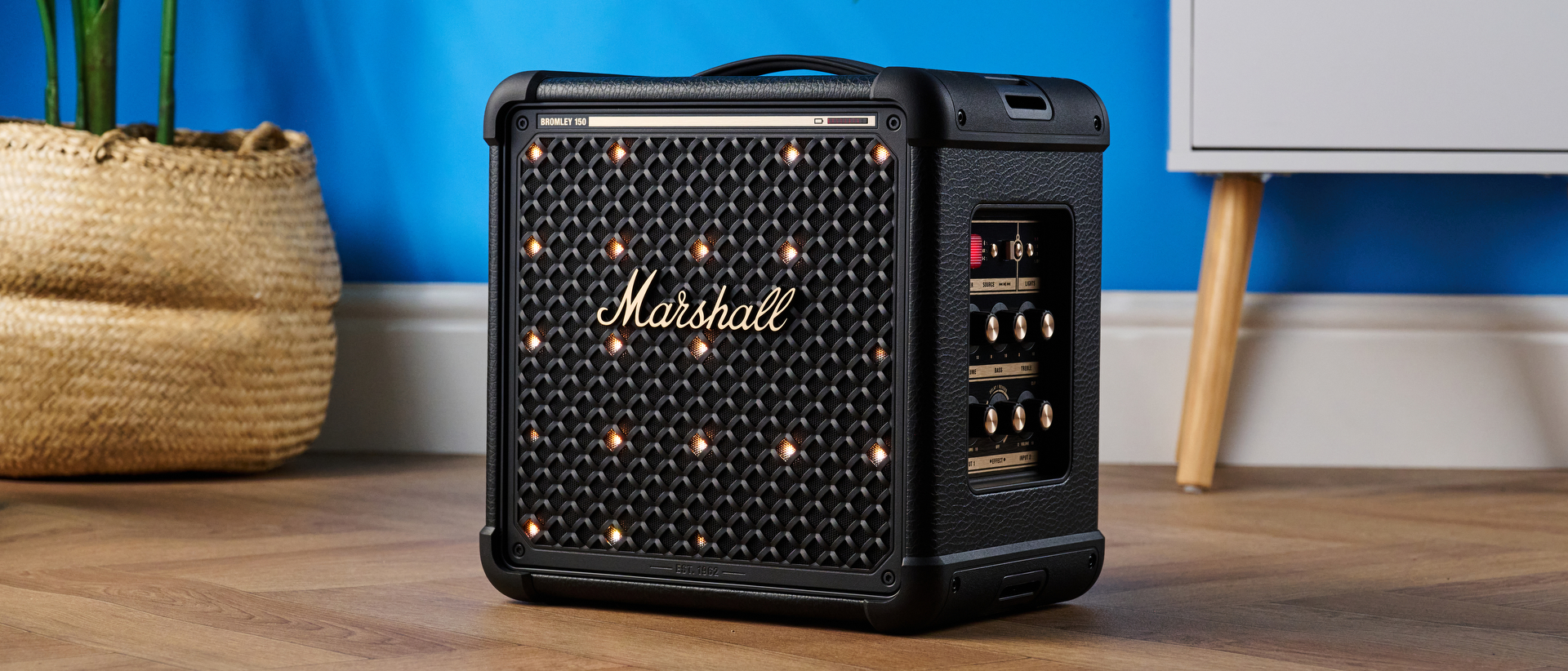 A black and brass Marshall Bromley 150 portable party speaker