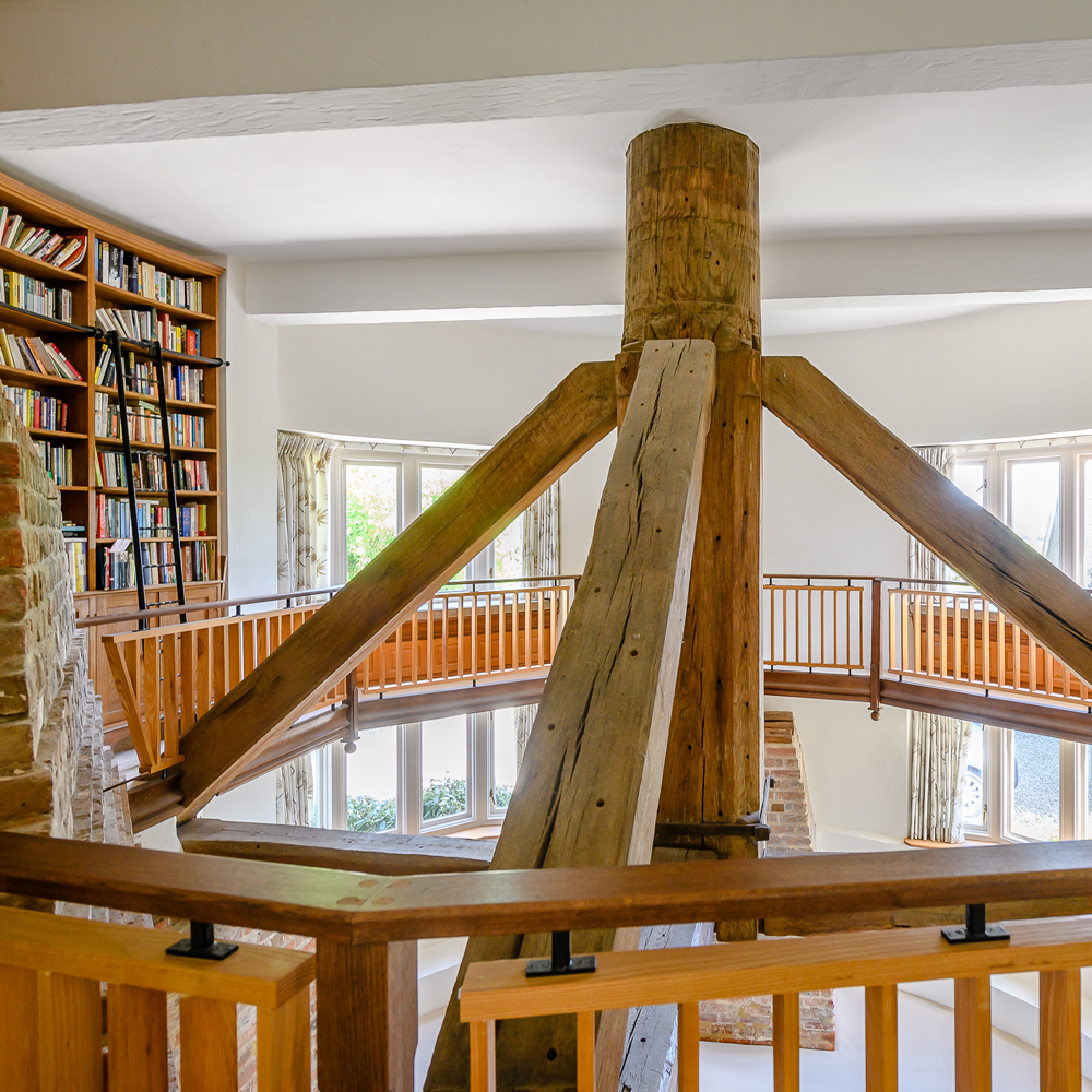 living room with open plan gallery and library