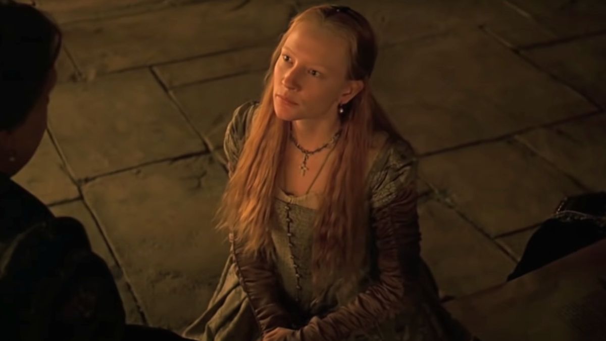 Cate Blanchett looks up attentively while kneeling on the floor in Elizabeth.