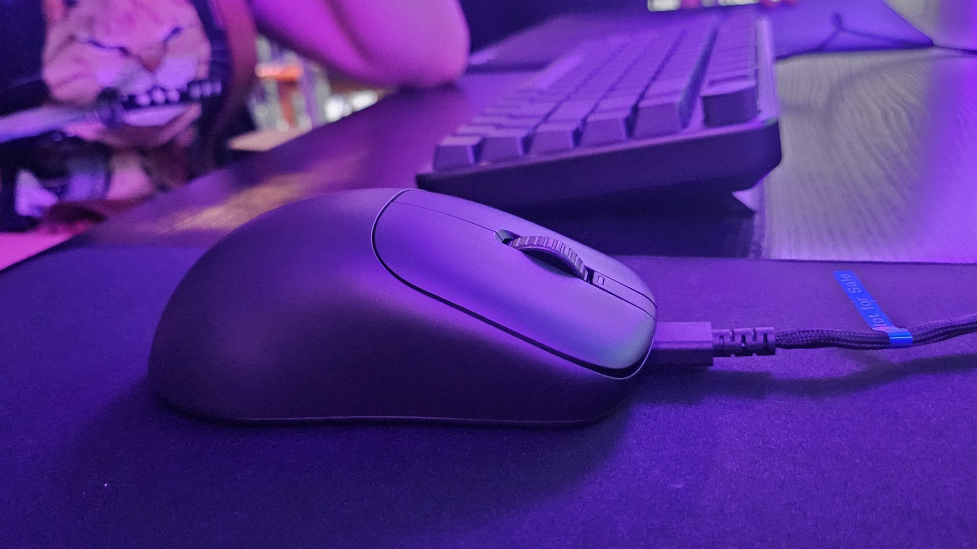 Sony Inzone Mouse-A on a mouse pad in a purple setup at Gamescom