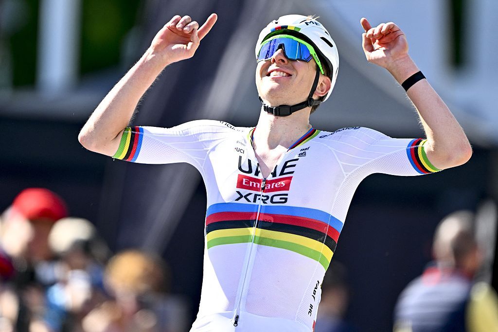 UAE Team Emirates' Slovenian rider Tadej Pogacar celebrates as he crosses the finish line to win the Liege-Bastogne-Liege one day cycling race, 252km from Liege, over Bastogne to Liege, on April 27, 2025. (Photo by ERIC LALMAND / Belga / AFP) / Belgium OUT