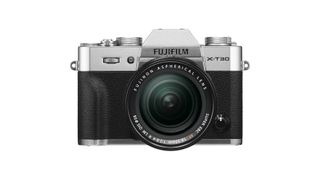 Fujifilm X-T30 camera front-on view, with silver finish and lens attached