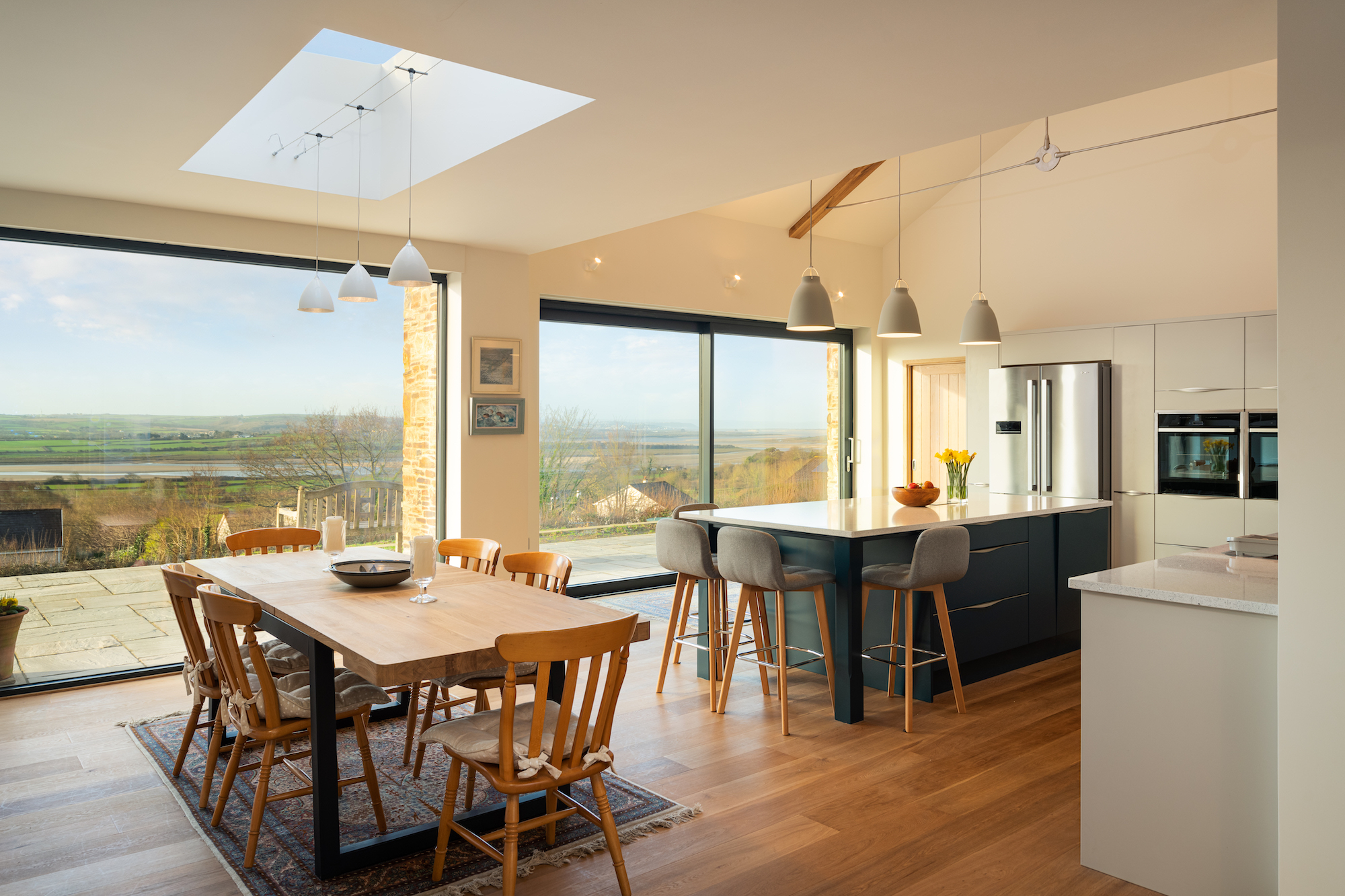 open plan kitchen and dining area with countryside views