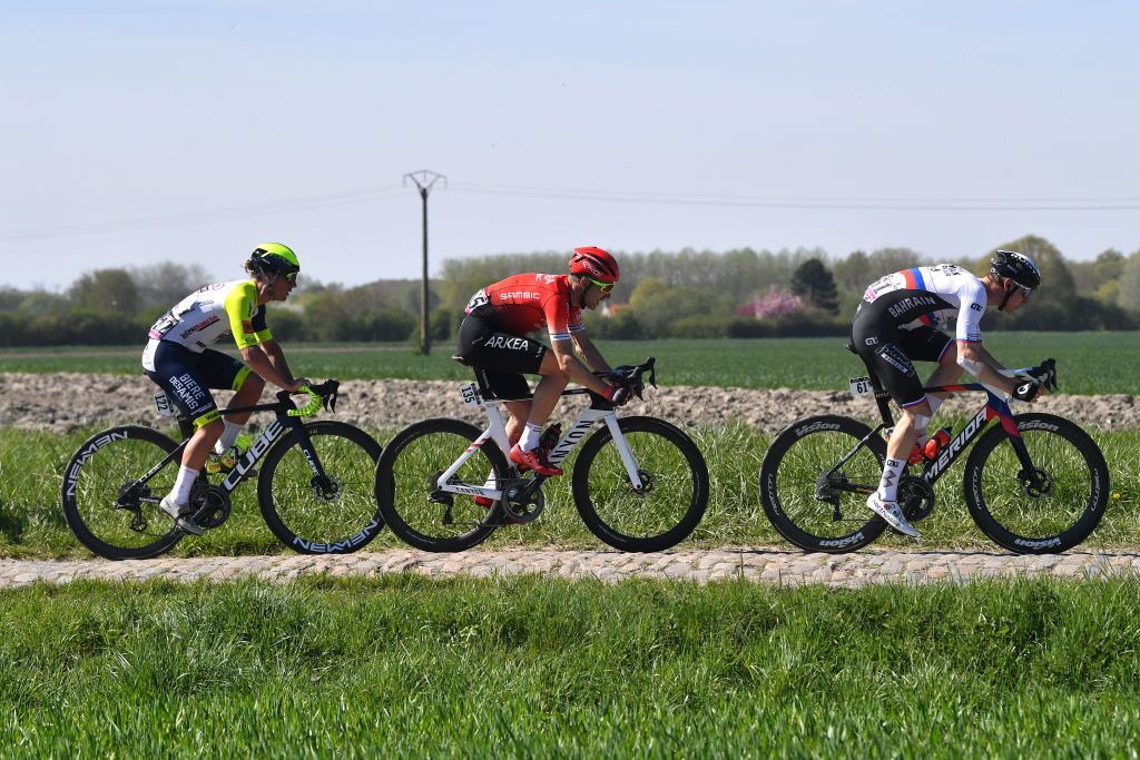 ROUBAIX FRANCE APRIL 17 LR Tom Devriendt of Belgium and Team Intermarch Wanty Gobert Matriaux Laurent Pichon of France and Team Arka Samsic and Matej Mohoric of Slovenia and Team Bahrain Victorious compete in the breakaway during the 119th ParisRoubaix 2022 Mens Elite a 2572km one day race from Compigne to Roubaix ParisRoubaix WorldTour on April 17 2022 in Roubaix France Photo by Luc ClaessenGetty Images
