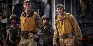 Midway soldiers walking on the top of an aircraft carrier