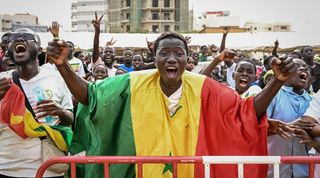 Senegal fans celebrate their World Cup victory over Qatar in Dakar.