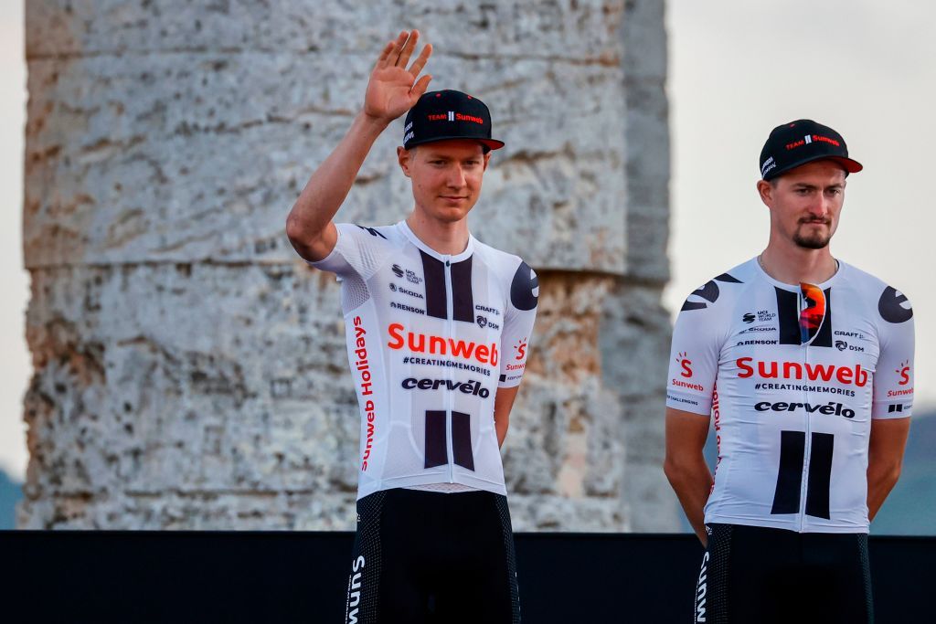 Team Sunweb rider Netherlands Wilco Kelderman C waves on stage at the Doric Temple of Segesta near Palermo Sicily on October 1 2020 during an opening ceremony of presentation of participating teams and riders two days ahead of the departure of the Giro dItalia 2020 cycling race Photo by Luca Bettini AFP Photo by LUCA BETTINIAFP via Getty Images