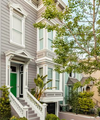 gray and white wooden period house