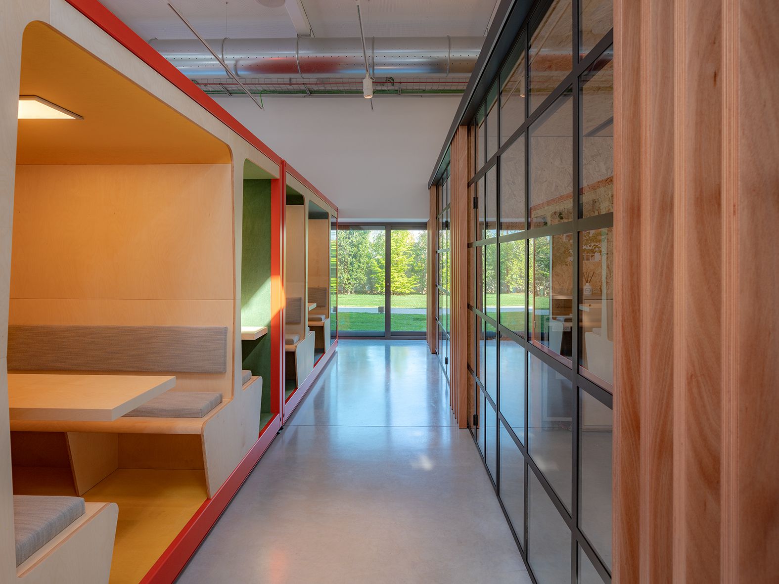 This is the campus for InfiniteArea in Treviso, a co-working space clad in warm timbers