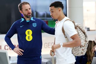 Gareth Southgate, Manager of England, greets Trent Alexander-Arnold of England as he arrives at St George's Park on October 09, 2023 in Burton upon Trent, England.