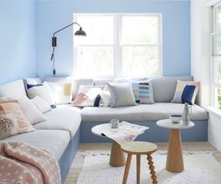 small living room with pale blue walls and corner sofa