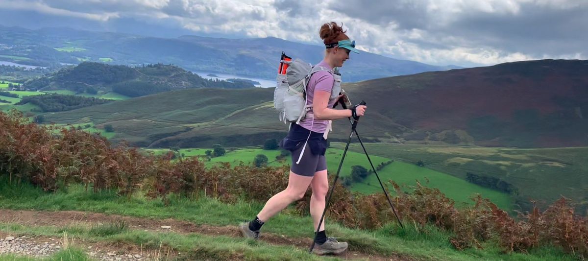 Woman trail running using Silva Carbon trail running poles