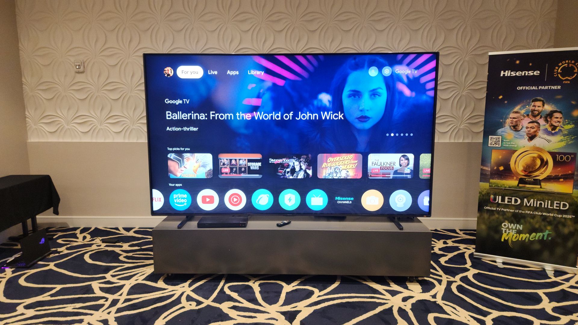 Hisense 116UX showing Google TV smart interface