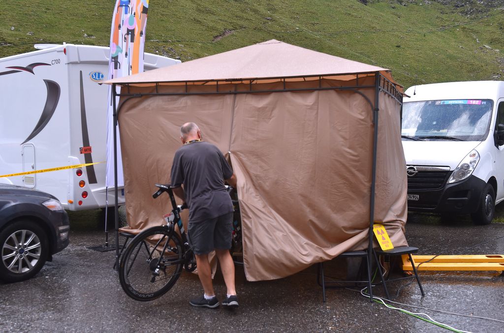 Chris Froome's race bike is taken into the tent to check for hidden motors or special wheels