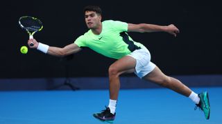 Carlos Alcaraz of Spain at full stretch on court at the Australian Open 2024, ahead of the Alcaraz vs Sonego live stream
