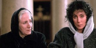 Rose Castorini (Olympia Dukakis) and Loretta Castorini (Cher) sit in church in Moonstruck (1987)