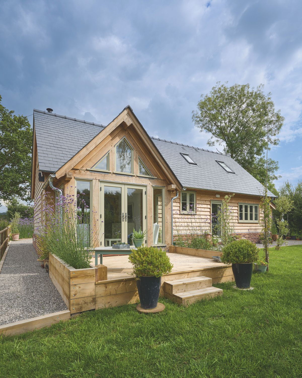 oak frame house with sunroom and patio doors