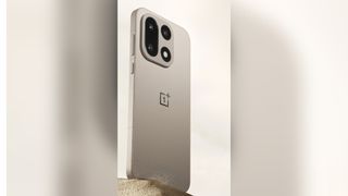 The OnePlus 15 in the Sand Storm color option
