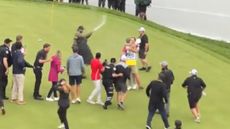 Adam Hadwin is tackled by security at the 2023 RBC Canadian Open