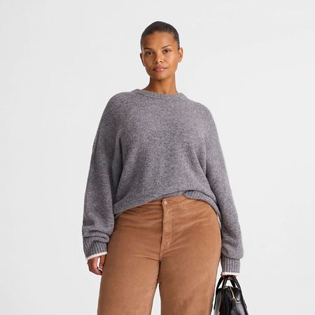 a madewell model wearing a gray sweater