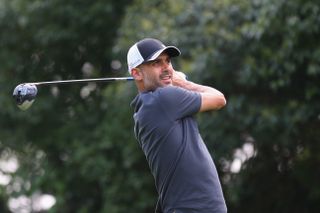 Pep Guardiola playing golf in China during Bayern Munich's pre-season tour in July 2015.