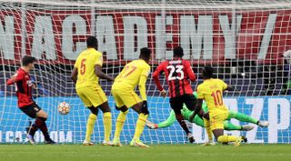 Fikayo Tomori, centre right, scores for AC Milan