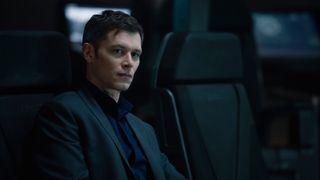 James Ackerson (Joseph Morgan) sitting in a chair in Halo season 2 episode 1