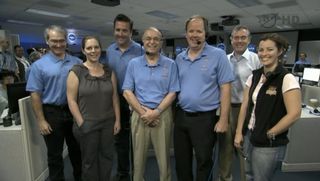 The team behind NASA's Mars rover Curiosity's Aug. 5 landing take a call from President Barack Obama on Aug. 13, 2012. At center is NASA Jet Propulsion Laboratory director Charles Elachi. Obama called the Mars landing "mindboggling."