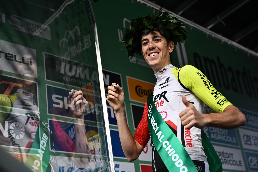 Intermarche&ndash;Wanty&rsquo;s Italian rider Simone Petilli gives a thumbs up on the sign-in podium as he celebrates his last race, ahead of the 119th edition of the Giro di Lombardia (Tour of Lombardy), a 238km cycling race from Como to Bergamo on October 11, 2025. (Photo by Marco BERTORELLO / AFP)