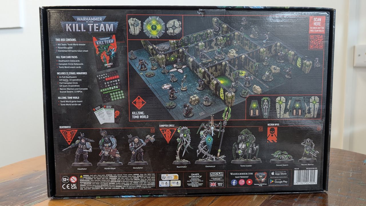 The back of the Kill Team: Tomb World box, on a wooden table