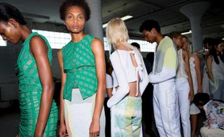 Eckhaus Latta S/S 2019 models dressed in green dresses and cut out crop tops