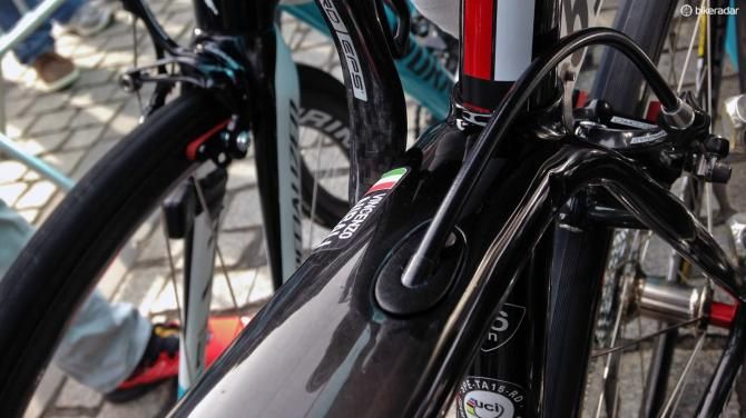 A removable stop for the rear brake housing should make it a little easier to feed the cable through