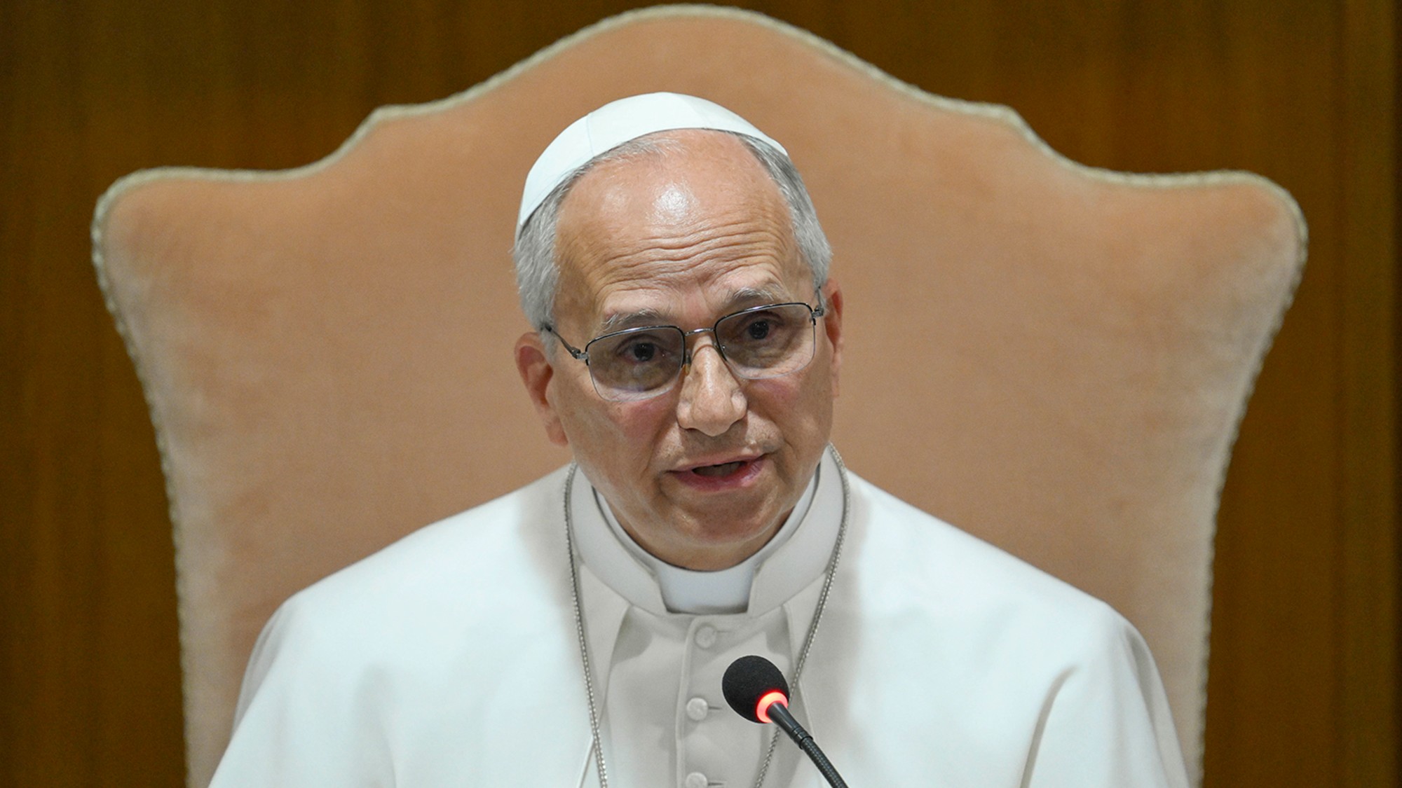 Pope Leo sitting in a chair